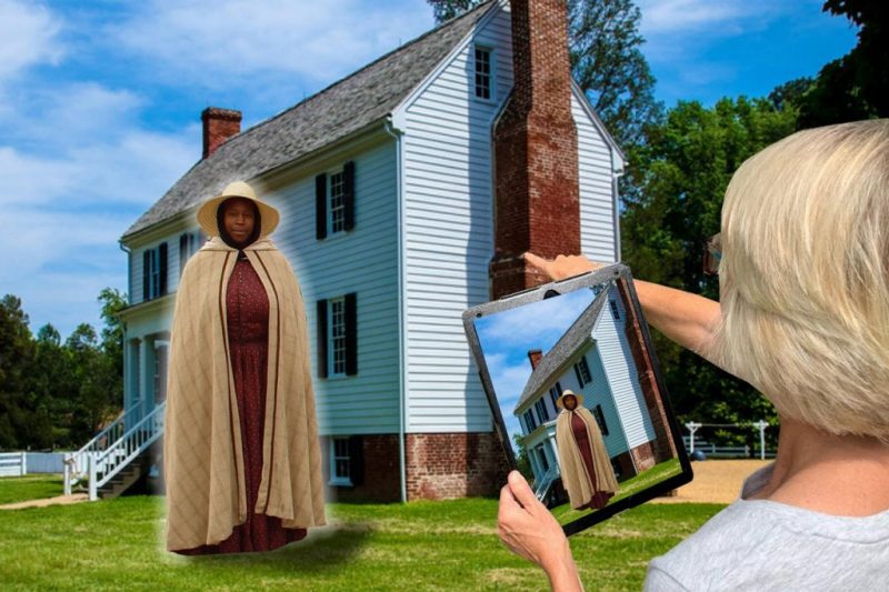 This illustration shows a potential design for an Augmented Reality application at Pamplin Historical Park. A women holding a tablet is viewing the image of an enslaved person. 
